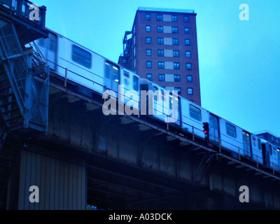 Night view from below of the New York City subway 1-train near 125th Street and Broadway. Stock Photo