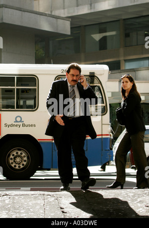 A man talks business on the mobile in Abercrombie lane George street Sydney Australia Stock Photo