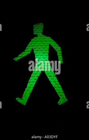 Green man go pedestrian traffic light sign Stock Photo - Alamy
