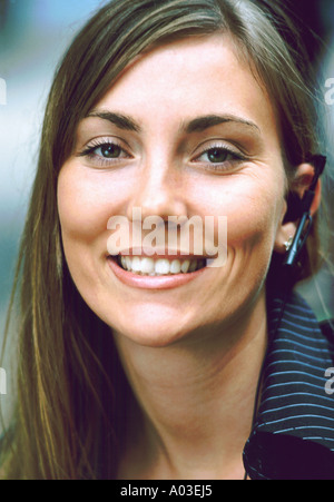 Headshot of business woman wearing telephone headset Stock Photo