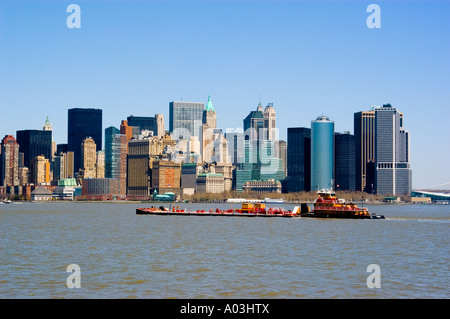 New York City New York Barge passes skyline of New York lower manhattan post 9 11 Stock Photo