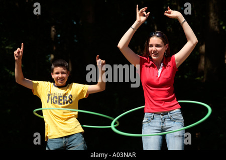 two kids with Hula Hoop tyres Stock Photo