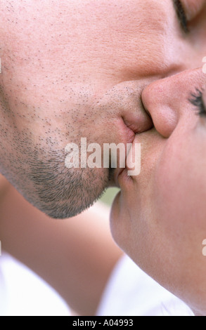 Close up portrait of a young couple kissing Stock Photo