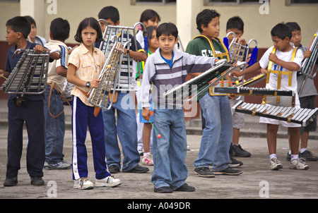 GUATEMALA PANAJACHEL Guatemalan school children practice playing marching bell percussion instruments Stock Photo