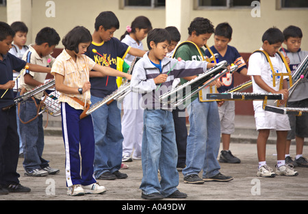 GUATEMALA PANAJACHEL Guatemalan school children practice playing marching bells for Independence Day Stock Photo