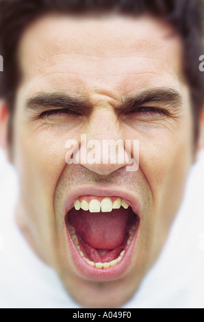 Close up portrait of young man shouting Stock Photo