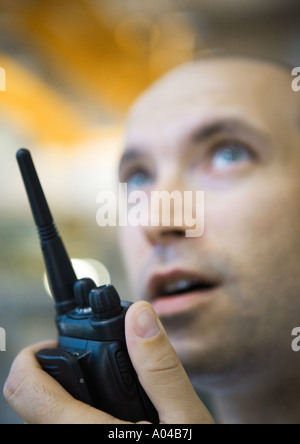 Factory worker using walkie talkie Stock Photo
