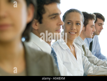 Business colleagues having meeting, focus on woman Stock Photo