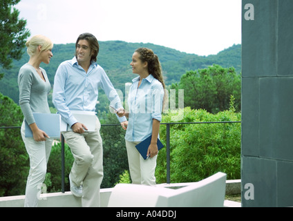 Casually dressed young executives working outdoors Stock Photo