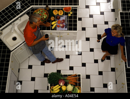 Couple at home cooking in kitchen Stock Photo