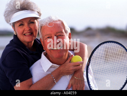 Retired Senior Couple Tennis Fun Aged 50s 60s Stock Photo