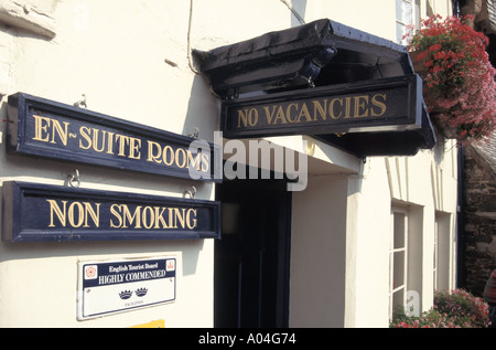 No vacancies sign on porch canopy at guest house & en suite rooms no smoking highly commended English Tourist board two star signs Somerset England UK Stock Photo