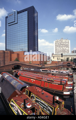 Urban view of narrowboats on Worcester and Birmingham Canal Gas Street Basin & Hyatt landmark skyscraper hotel in Birmingham West Midlands England UK Stock Photo