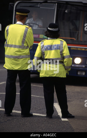 Birmingham traffic warden on duty alongside police officer Stock Photo