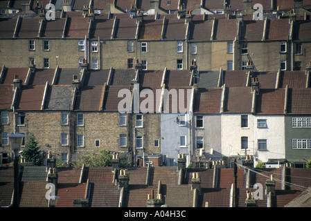 Rows of terraced homes on hillside seen from public pavement Stock Photo