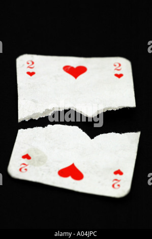 Two of hearts playing card torn in half Stock Photo: 5644780 - Alamy