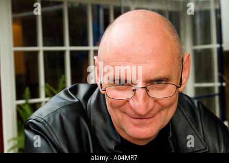 Cool looking older man with shaven head Stock Photo