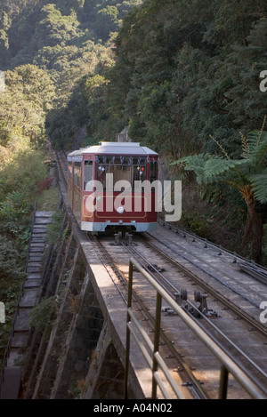 dh Peak Tram VICTORIA PEAK HONG KONG Tram climbing arriving Barker Road station Stock Photo