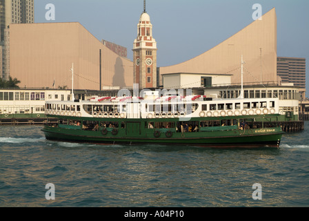 dh Star Ferry terminal TSIM SHA TSUI HONG KONG Solar Star ferry KCR Victorian clock tower and HK Cultural Centre harbour harbor Stock Photo