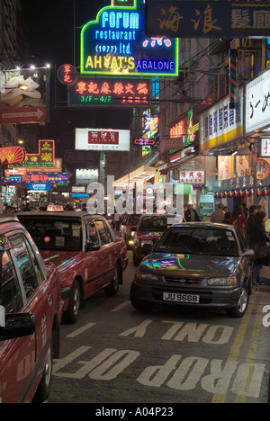 dh Lockhart Road CAUSEWAY BAY HONG KONG Taxis car and traffic jam night neon lights advertising signs city street Stock Photo