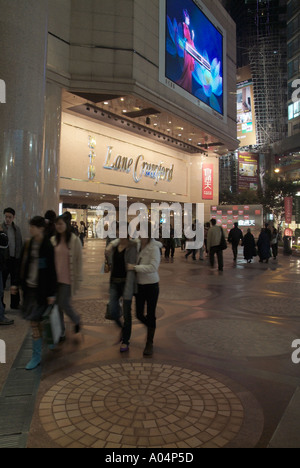 dh Lane Crawford Time Square CAUSEWAY BAY HONG KONG Store crowds on night shoppers scene pedestrians shops pedestrian at plaza Stock Photo
