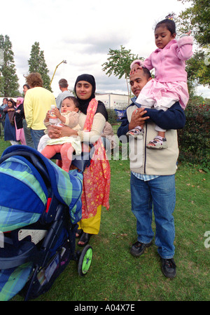 Bangladeshi family celebrating at summer festival near Brick Lane in east London.