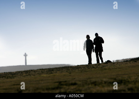 Celtic Cross, Couple walking on Tennyson Down Freshwater Isle of Wight England UK Great Britain Stock Photo