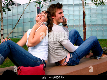 young couple talking on the phone Stock Photo