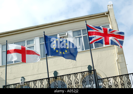 English flag of St George, British Union Flag, and European Union flay flying side by side Stock Photo