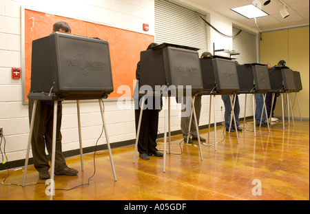 Voters cast ballots in presidential election using a touch screen at the Langston Brown Community Ctr in Arlington Virginia Stock Photo