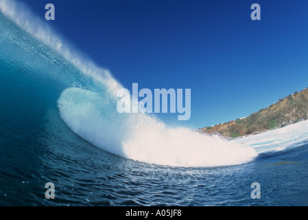 Curl of a wave crashing on a beautiful sunny day in Maui Hawaii Stock Photo