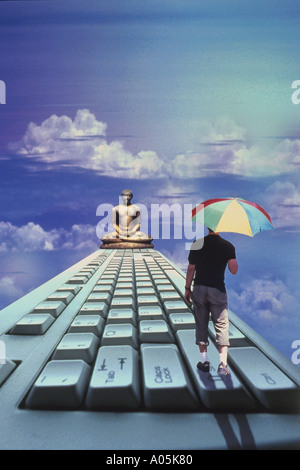 Conceptual image of a businessman with an umbrella walking on top of a computer keyboard with a Buddha statue on the other end Stock Photo