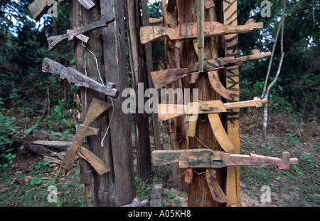 Wooden guns adorn an Akha spirit gate, to ward of evil. Muang Sing district, Luang Nam Tha, Laos. Stock Photo