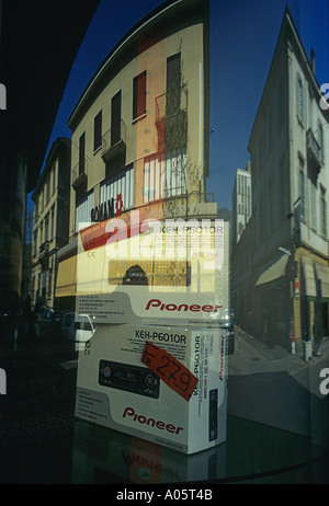 buildings reflected on an electronics shop window in Chiasso Canton Ticino Switzerland Stock Photo