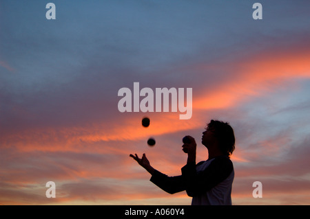 Juggler throwing balls in the air Stock Photo