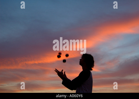 Juggler throwing balls in the air Stock Photo