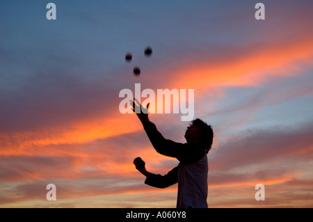 Juggler throwing balls in the air Stock Photo