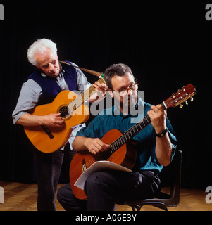 Education music tuition adult man learning to play the guitar Stock Photo