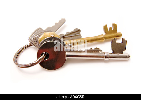 Bunch of house keys isolated on a white studio background. Stock Photo