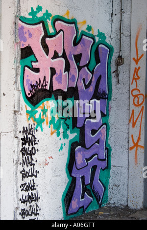 Urban graffiti spray painting on an old derelict abandoned warehouse wall in Dundee, UK Stock Photo