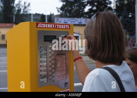 Woman late thirties buys tram tickets Prague Czech Republic Stock Photo