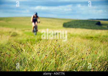 Female mountain biker on Crosby Ravensworth Fell in Cumbria Stock Photo