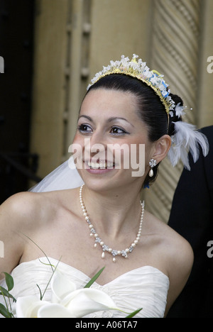 bride at uk wedding after the ceremony looking away from camera Stock Photo