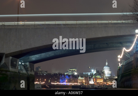 Waterloo Bridge at night from Thames foreshore. London, England Stock Photo