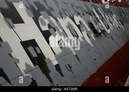 graphic detail shot of ship welder and ship welding  painting protective coating being applied at Hong Kong United Dockyard HUD Stock Photo