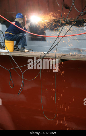 graphic detail shot of ship repair and ship painting and protective coating being applied at Hong Kong United Dockyard HUD Stock Photo