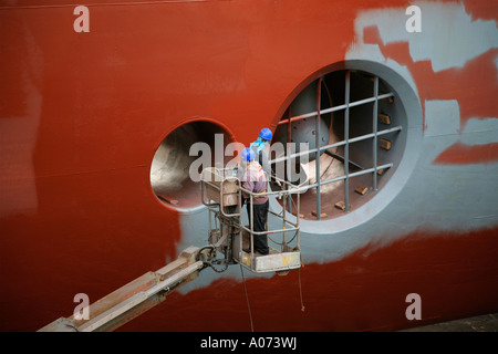 graphic detail shot of ship repair and ship painting and protective coating being applied at Hong Kong United Dockyard HUD Stock Photo