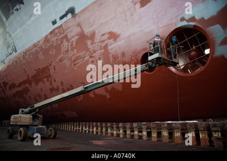 graphic detail shot of ship repair and ship painting and protective coating being applied at Hong Kong United Dockyard HUD Stock Photo