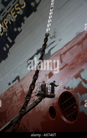 graphic detail shot of ship repair and ship painting and protective coating being applied at Hong Kong United Dockyard HUD Stock Photo