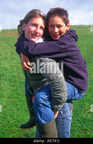 Boy Giving Piggyback Ride To Twin Sister Stock Photo - Image of game,  friend: 233593328